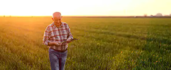 Farmer walking, preserving the land