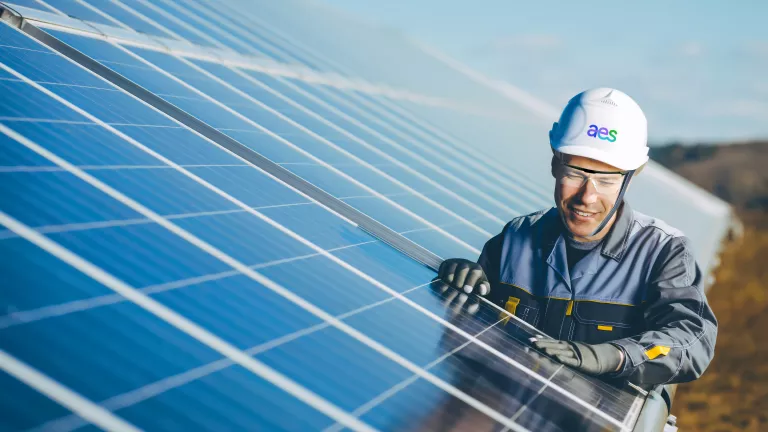 Man working on solar panel