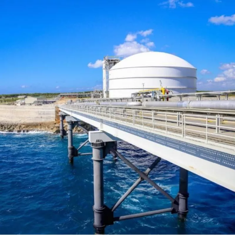 A pipeline bridge over water leading to a fuel facility